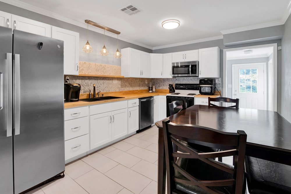 This image highlights a modern and inviting kitchen with a sleek, functional design.