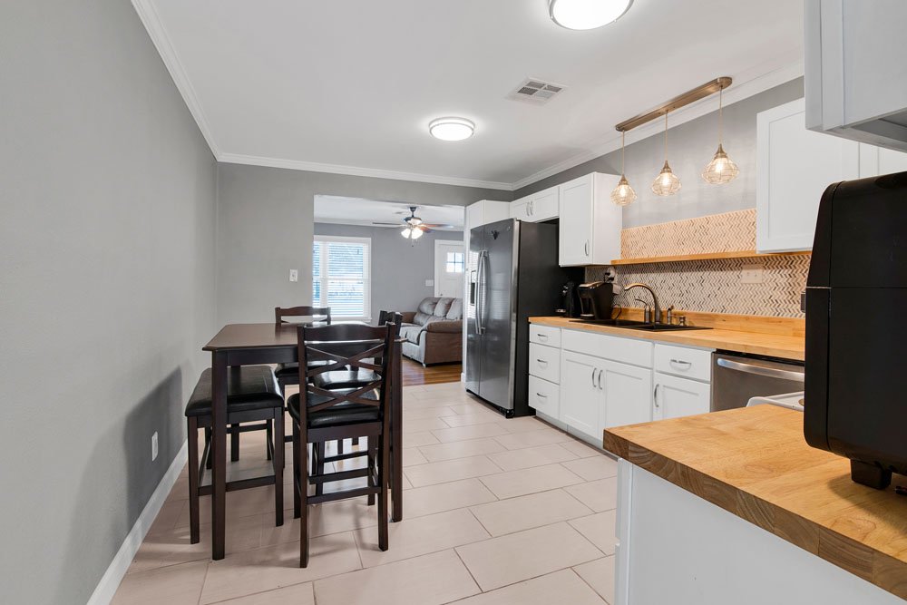 An open-concept kitchen and dining area with a seamless transition to the adjacent living room.